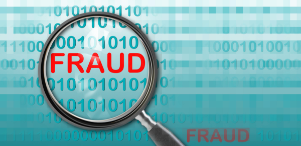 fraud-in-red-under-magnifying-glass